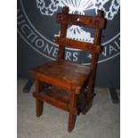 A 19th century stained pine metamorphic chair, the horizontal splats with pierced crescent and