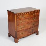 A George III mahogany serpentine chest, the shaped rectangular top with a moulded edge above an