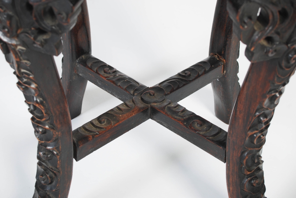 A Chinese dark wood jardiniere stand, Qing Dynasty, the circular top with a round porcelain panel - Image 6 of 7