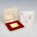 A 22ct gold Royal Mint limited edition 'Universal Postal Union 1874-1974 £1 stamp', number 0411 of