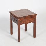 A Chinese dark wood stool, late 19th/early 20th century, the square panelled top above a frieze