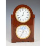 A 20th century mahogany cased mantel/calendar clock, the upper dial with Roman numerals, the lower