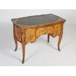 A 19th century kingwood, satinwood, marquetry inlaid and ormolu mounted writing table, the shaped