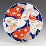 A Japanese Imari porcelain charger, late 19th/early 20th century, decorated with leaf shaped