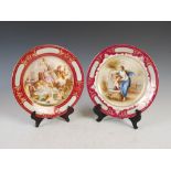 A pair of Vienna porcelain puce ground cabinet plates, decorated with named scenes Neckerei,