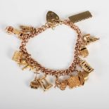 A 9ct gold charm bracelet, suspending thirteen assorted charms, with heart shaped locket, 59.8