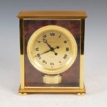 A Jaeger-Le Coultre Atmos Elysee mantle clock, in brass case with circular Roman numeral dial,