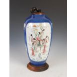 A Chinese porcelain powder blue ground famille rose vase converted to a table lamp, Qing Dynasty,