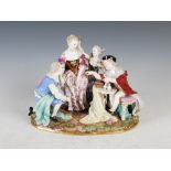 A late 19th/early 20th century Meissen porcelain figure group, modelled with lady, attendant male,
