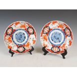 A pair of Japanese Imari porcelain plates, late 19th/early 20th century, decorated with circular