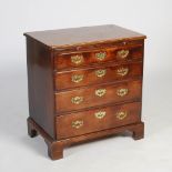 A George III mahogany bachelors chest, the rectangular top with moulded edge above a pull out