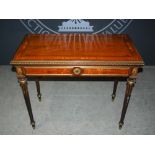 A late 19th century mahogany, kingwood, marquetry and gilt metal mounted fold over card table in the