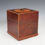 A George III mahogany and satinwood banded decanter box, the hinged square shaped cover inlaid
