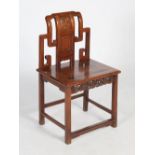 A Chinese dark wood side chair, Qing Dynasty, the scroll carved back enclosing a panelled