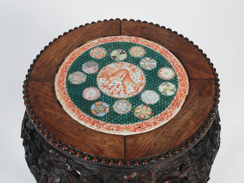 A Chinese dark wood jardiniere stand, Qing Dynasty, the circular top with a round porcelain panel - Image 3 of 7
