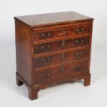 A George III mahogany bachelors chest, the rectangular top with moulded edge above brush slide and