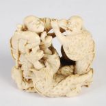 A Japanese ivory okimono of four blind men fighting, Meiji Period, signed Chikuyosai Tomochika,