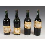 Four vintage bottles of Madeira Fine Old Sercial, Brought to Maturity and Recommended by Mathew