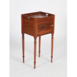 An early 19th century mahogany bedside locker / pot cupboard, the rectangular top with raised