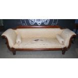 An early 19th century mahogany Regency style sofa, the brocade upholstered back, arms and seat