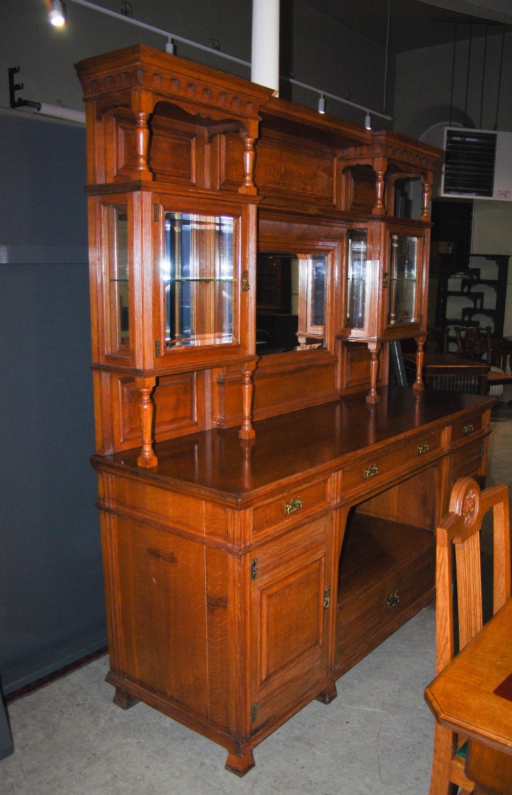 A late 19th century oak dining room room suite, comprising; an extending dining table enclosing four - Image 2 of 9