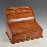 A 19th century walnut writing slope with adjustable calendar, the upright back with adjustable