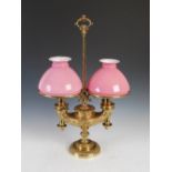 A late 19th/early 20th century German patent brass two light paraffin burning lamp converted to