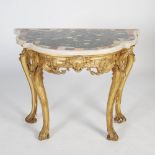 A George III gilt wood marble top console table, the shaped specimen marble top above a frieze