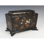 A Victorian papier mache and mother-of-pearl inlaid sarcophagus shaped tea caddy, decorated with