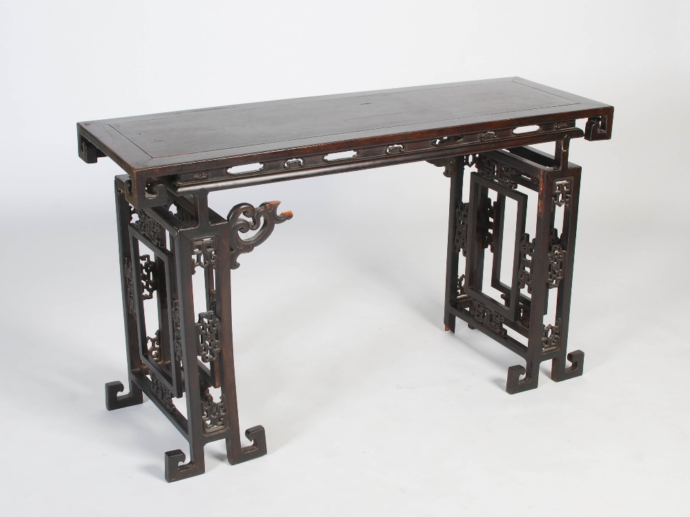 A Chinese dark wood table, late 19th/early 20th century, the rectangular panelled top above a - Image 10 of 10