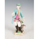 An 18th century English porcelain figure of a postman, modelled standing holding a letter in his
