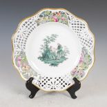A Meissen porcelain cabinet plate, decorated with hand painted scene of female and attendant male