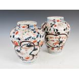 A pair of Japanese Imari porcelain jars, Edo Period, decorated with quatrefoil and heart shaped