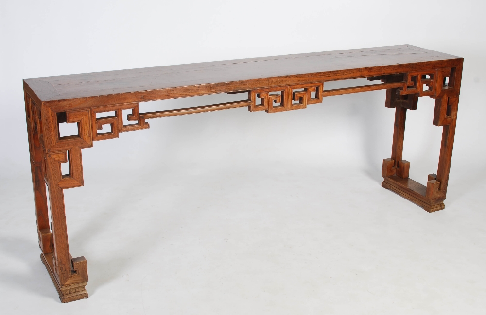 A Chinese blonde wood rectangular table, late 19th/early 20th century, the rectangular panelled