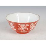 A Chinese iron red and white reverse decorated octagonal shaped bowl, Qing Dynasty, decorated with