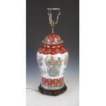 A Chinese porcelain jar and cover mounted as a table lamp, 20th century, decorated with five baskets