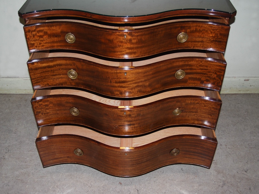 An early 20th century George III style mahogany serpentine chest, the shaped top above four long - Image 8 of 12