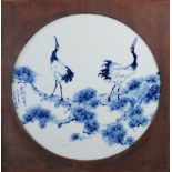 A Japanese blue, white and copper red porcelain panel, 20th century, decorated with pine branch