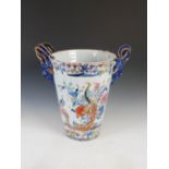 A 19th century blue printed and hand coloured twin handled pottery pail, decorated with a Japan