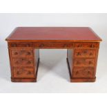 A Victorian mahogany pedestal desk, the rounded rectangular top with a faux leather skiver above