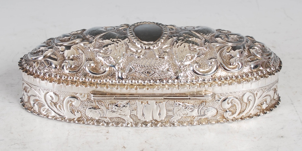 A Victorian silver oval shaped box and cover, Birmingham, 1891, makers mark of H&A, with embossed - Image 3 of 9