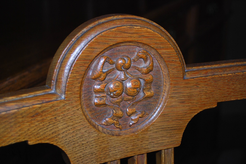 A late 19th century oak dining room room suite, comprising; an extending dining table enclosing four - Image 9 of 9