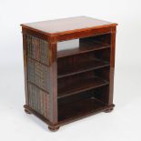 A Regency style rosewood double sided free standing open bookcase, the rectangular top with a gilt