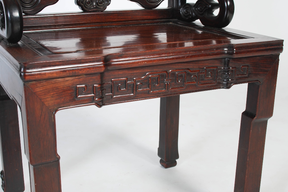 A Chinese hongmu chair, Qing Dynasty, early 19th century, the scroll carved back centred with a - Image 4 of 7