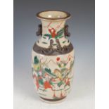 A Chinese porcelain crackle glazed warrior vase, Qing Dynasty, decorated with warriors within