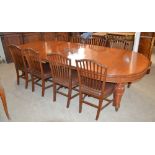 A 19th century mahogany extending dining table together with a set of eight mahogany Hepplewhite