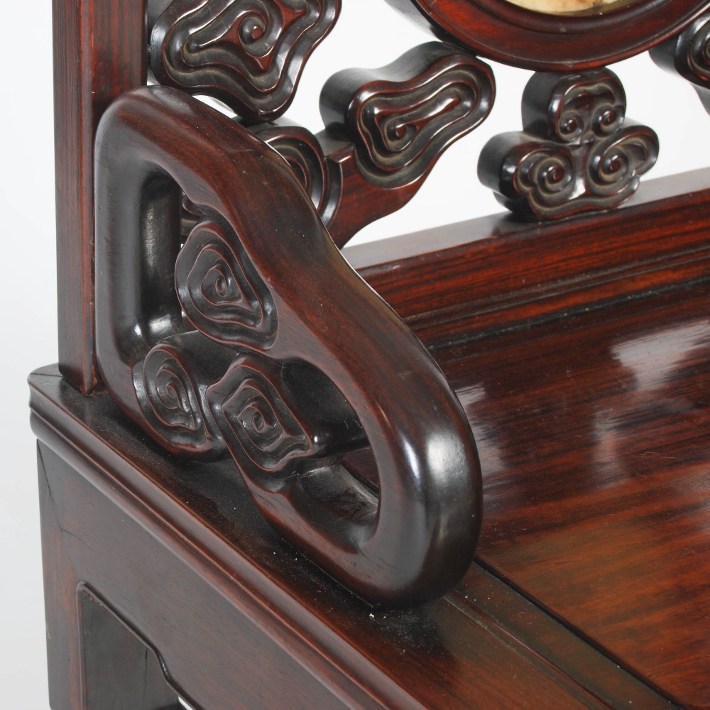 A Chinese hongmu chair, Qing Dynasty, early 19th century, the scroll carved back centred with a - Image 5 of 7