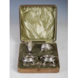 A cased Art Nouveau silver four piece condiment set, Birmingham, 1907, makers mark of J.F for J.