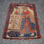 A Persian rug/ prayer mat, late 19th/ early 20th century, the rectangular field decorated with a