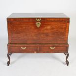 A George III mahogany and brass bound chest on stand, the rectangular chest with brass inlaid